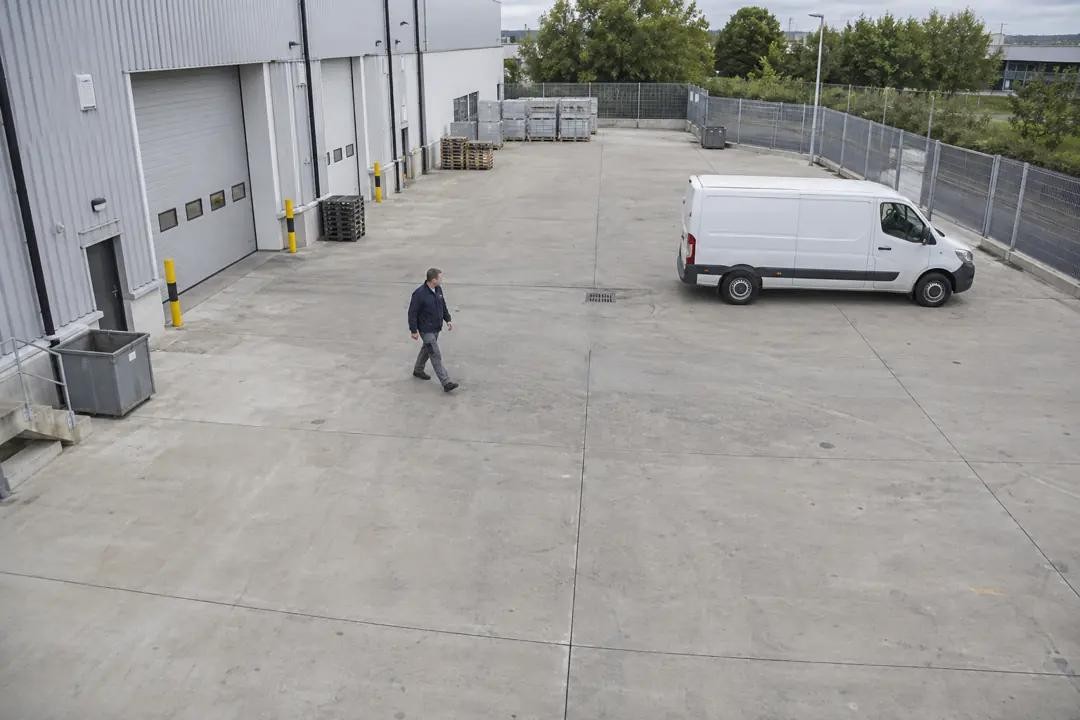 Equipment yard after hours with a person detected inside the perimeter